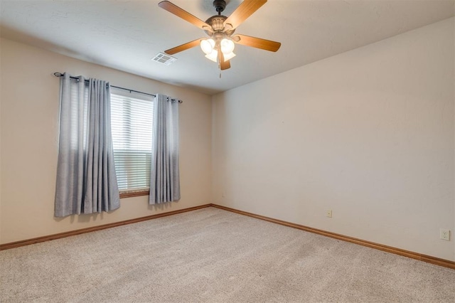 carpeted empty room featuring ceiling fan