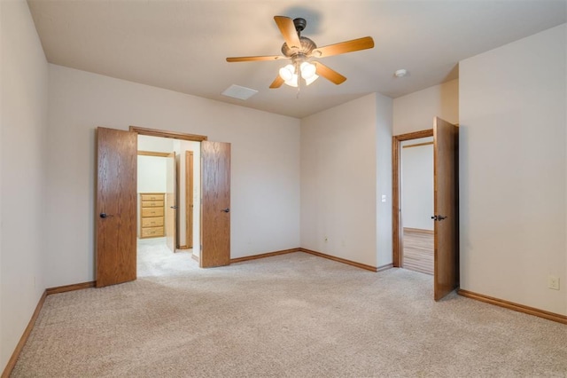 unfurnished bedroom featuring ceiling fan and light colored carpet