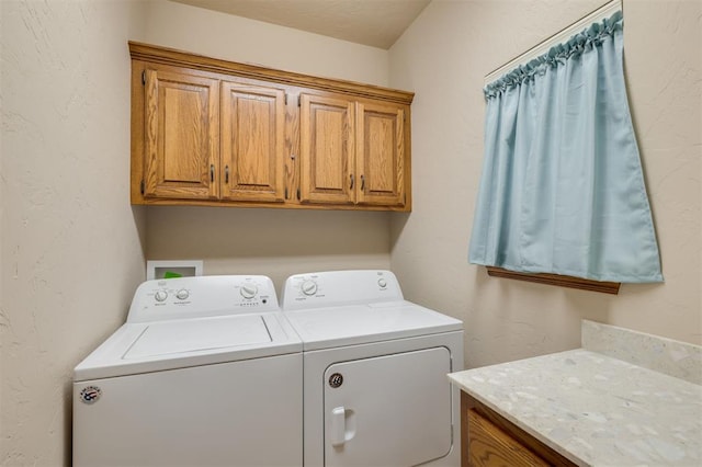 laundry area with cabinets and washer and dryer