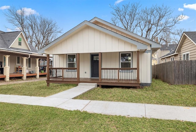 view of front of house with a front lawn and a porch