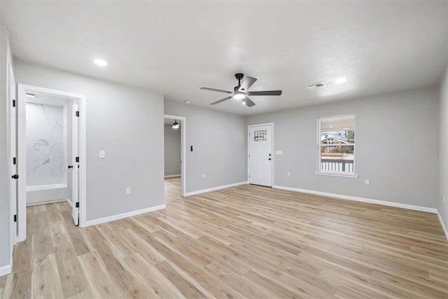 spare room with ceiling fan and light hardwood / wood-style flooring