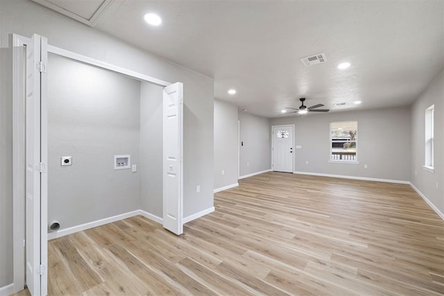 unfurnished living room with ceiling fan and light wood-type flooring