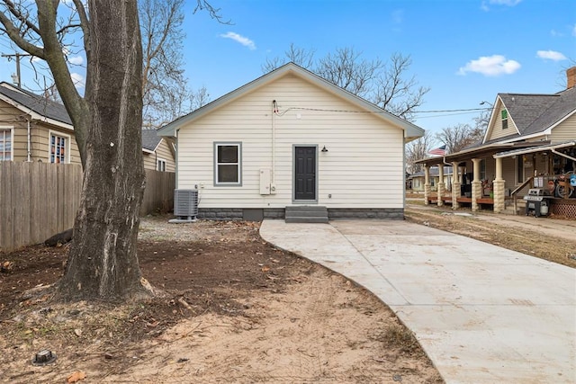 rear view of house with central AC