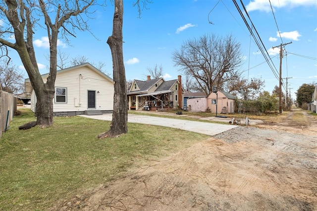 exterior space with a carport and a front yard