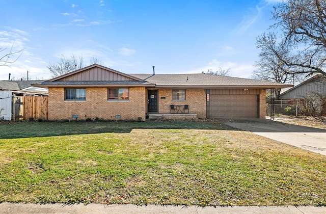 single story home with a garage and a front lawn