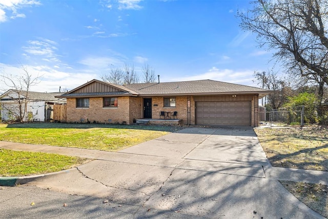 ranch-style home featuring a front lawn and a garage