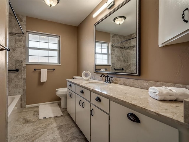 bathroom with toilet, bathing tub / shower combination, baseboards, and vanity