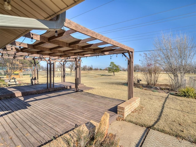 wooden terrace featuring a rural view and a pergola