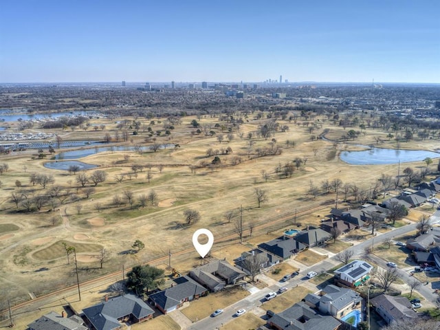 drone / aerial view with a water view and a residential view