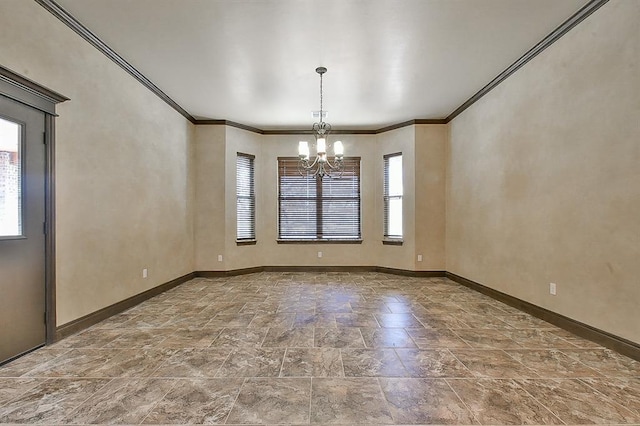 empty room with stone finish floor, baseboards, a chandelier, and ornamental molding