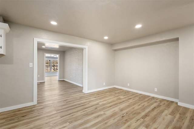 spare room featuring light wood-type flooring