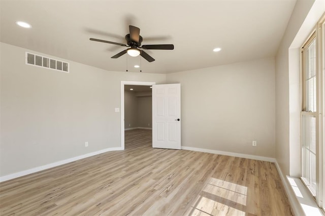 unfurnished bedroom with ceiling fan and light hardwood / wood-style floors