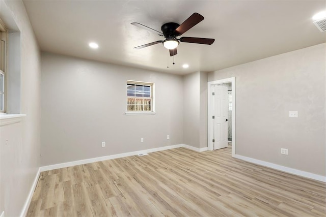 empty room featuring light hardwood / wood-style flooring and ceiling fan