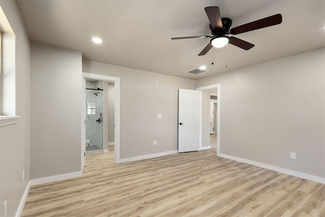 unfurnished bedroom featuring connected bathroom, ceiling fan, and light hardwood / wood-style floors