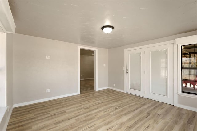 unfurnished room with light hardwood / wood-style flooring