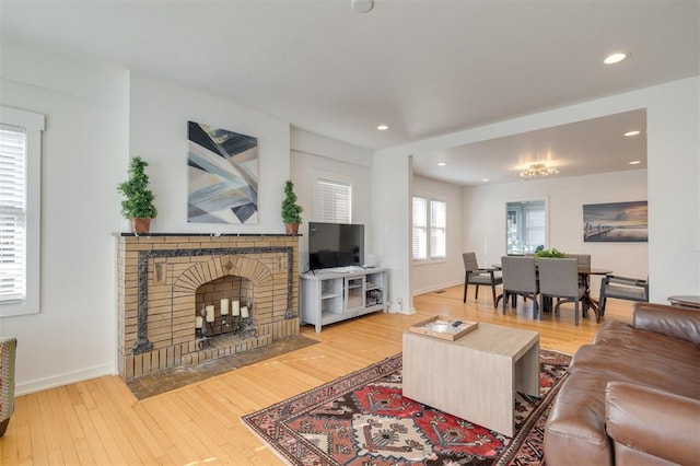 living room with a fireplace and hardwood / wood-style floors