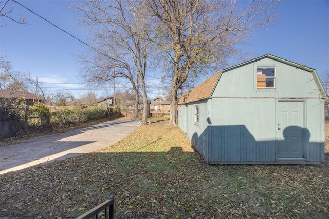 view of home's exterior with a storage shed