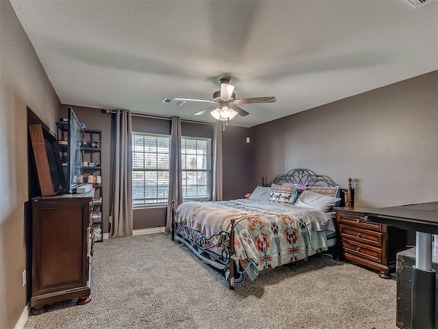 bedroom featuring ceiling fan and carpet