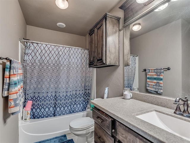 full bathroom featuring shower / bath combo with shower curtain, tile patterned flooring, vanity, and toilet