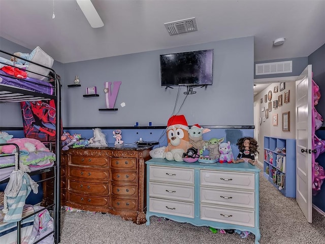 bedroom featuring light carpet and ceiling fan