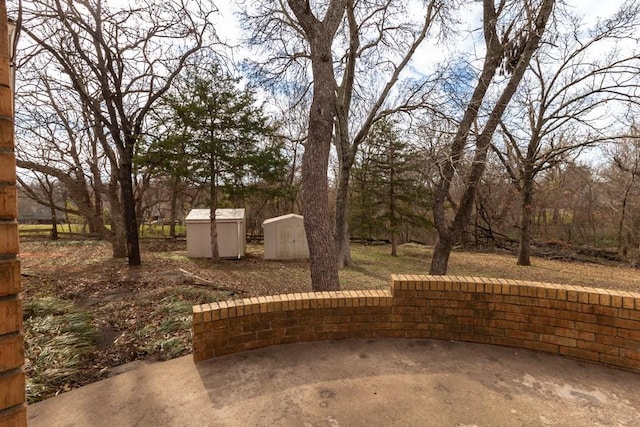 view of patio with a storage shed