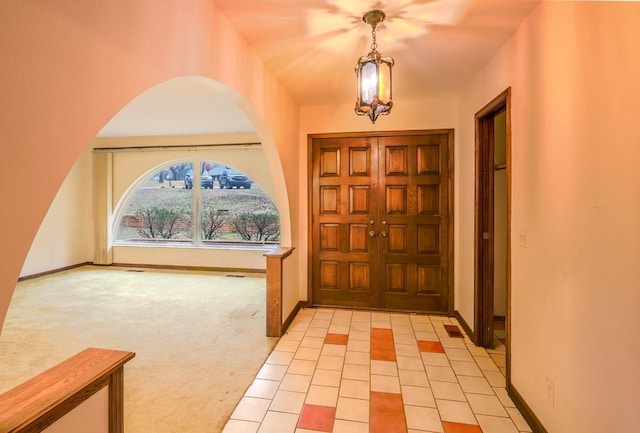 view of carpeted foyer