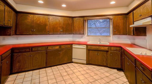 kitchen with light tile patterned floors, white appliances, tasteful backsplash, and sink