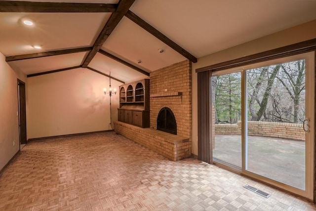 unfurnished living room with vaulted ceiling with beams, a fireplace, parquet floors, and an inviting chandelier