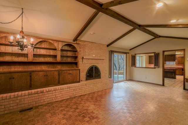 unfurnished living room featuring vaulted ceiling with beams, a fireplace, parquet floors, and a chandelier