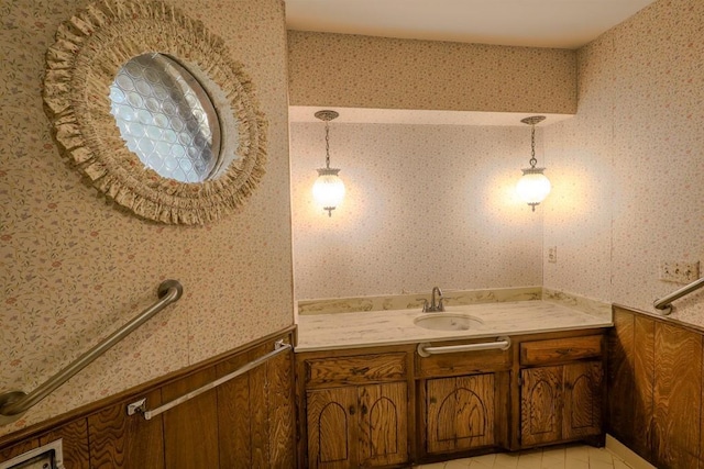 bathroom with tile patterned flooring and vanity