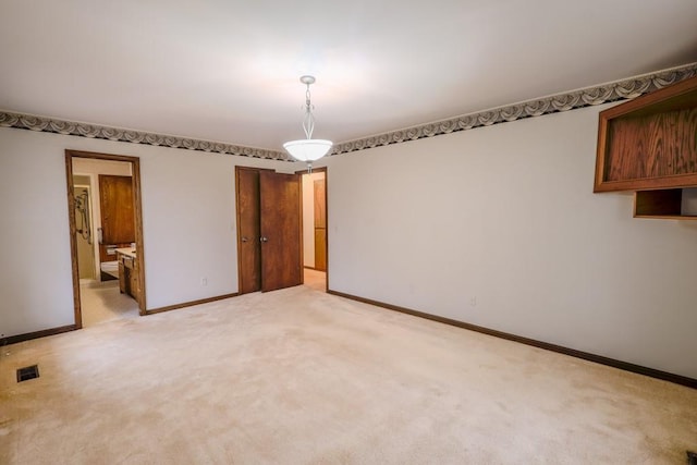 interior space featuring light colored carpet