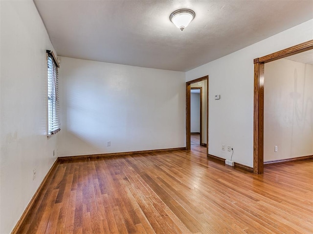 spare room with wood-type flooring