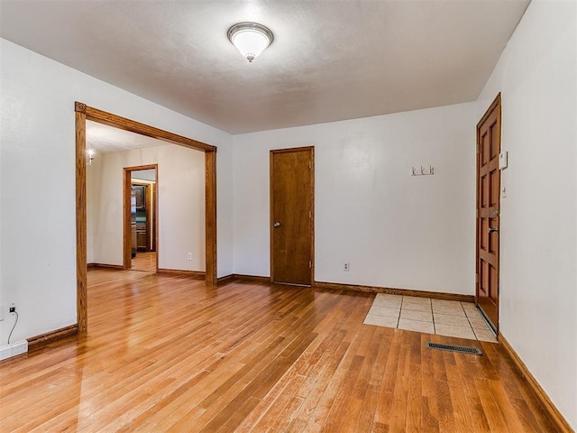 empty room featuring hardwood / wood-style flooring