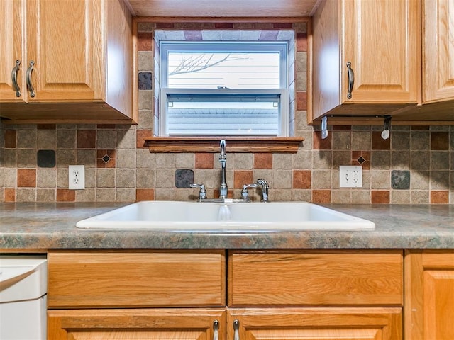 kitchen with decorative backsplash and sink