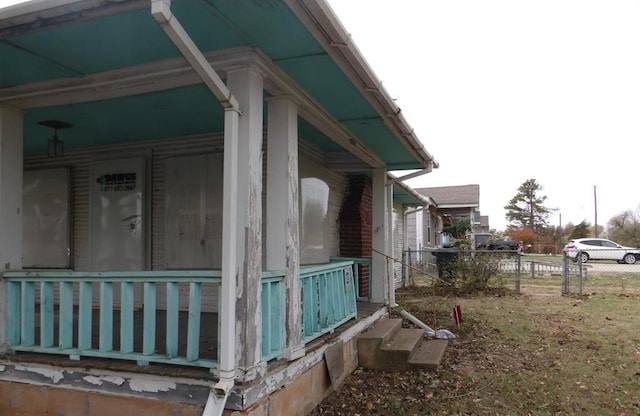 view of property exterior featuring covered porch