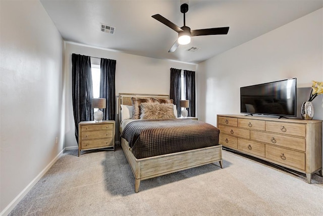 bedroom with ceiling fan and light carpet