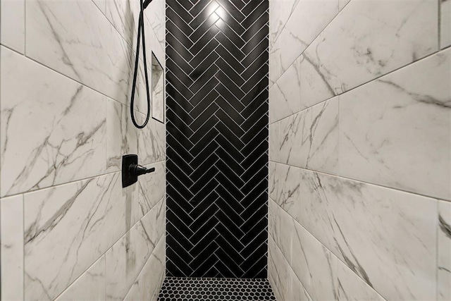 details featuring a tile shower