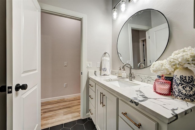 bathroom with wood-type flooring and vanity