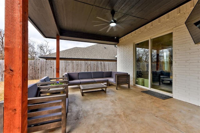 view of patio with an outdoor living space and ceiling fan