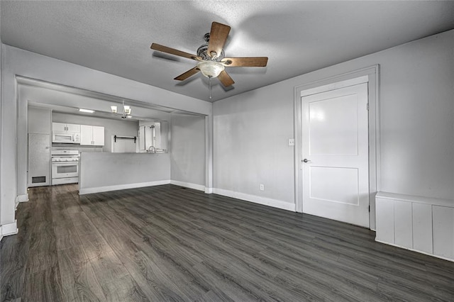 unfurnished living room featuring a textured ceiling, ceiling fan, and dark wood-type flooring