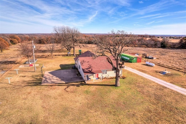 birds eye view of property featuring a rural view