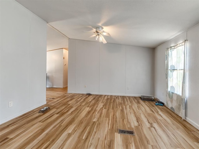 spare room with ceiling fan and light hardwood / wood-style flooring