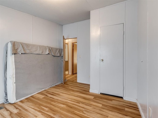 unfurnished bedroom featuring light hardwood / wood-style floors