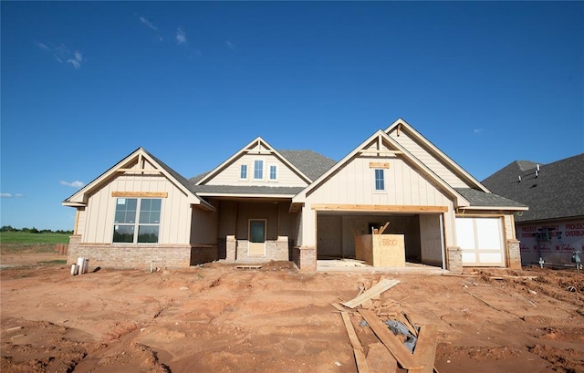 5800 Lantana Ln, Edmond, OK 73034 - view of front of property with board and batten siding and brick siding