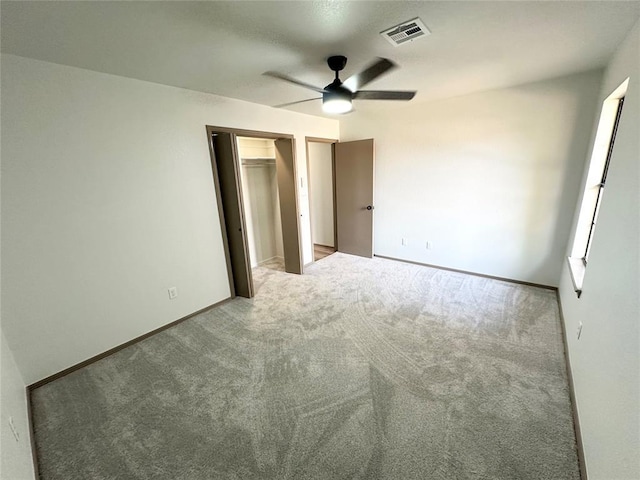 unfurnished bedroom with carpet and ceiling fan