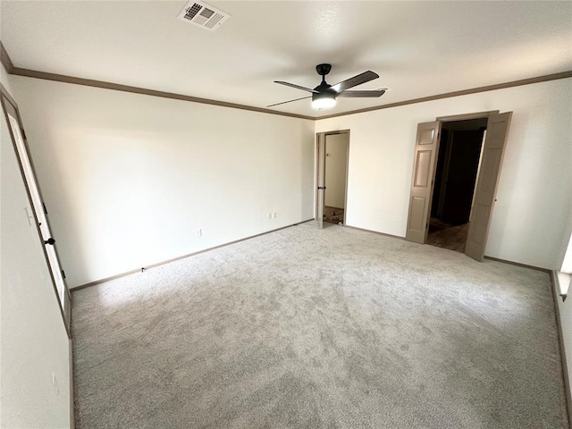 unfurnished bedroom featuring ceiling fan, carpet floors, and ornamental molding