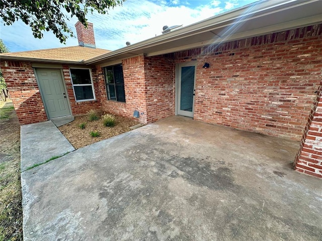 property entrance with a patio area