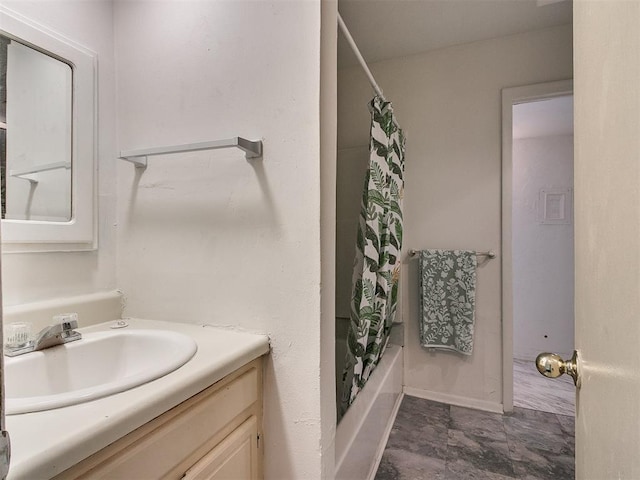 bathroom featuring vanity and shower / bath combination with curtain