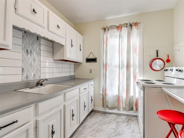 kitchen with white cabinets, white range with electric stovetop, sink, and tasteful backsplash