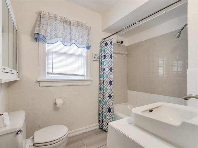 full bathroom featuring sink, shower / bath combination with curtain, wood-type flooring, and toilet